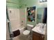 Simple bathroom with a bathtub, toilet and sink at 2172 W Pinkley Ave, Coolidge, AZ 85128