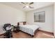 Bedroom with vinyl floor, ceiling fan, large window and a bed at 2172 W Pinkley Ave, Coolidge, AZ 85128