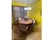 Dining area with wood table and yellow walls at 2172 W Pinkley Ave, Coolidge, AZ 85128