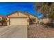 Charming single-story home showcasing a well-maintained front yard and attached two-car garage at 2172 W Pinkley Ave, Coolidge, AZ 85128