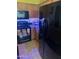 Black refrigerator and stove in a well-lit kitchen at 2172 W Pinkley Ave, Coolidge, AZ 85128