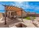 Inviting backyard patio with shaded pergola, comfortable seating, and a built-in fire pit, perfect for outdoor gatherings at 2172 W Pinkley Ave, Coolidge, AZ 85128