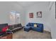 Relaxing bedroom with sectional sofa and plenty of natural light at 2181 W Thompson Pl, Chandler, AZ 85286