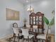 Formal dining room with hardwood floors, chandelier, and hutch at 2181 W Thompson Pl, Chandler, AZ 85286