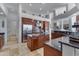 Gourmet kitchen with island, stainless steel appliances, and granite countertops at 2181 W Thompson Pl, Chandler, AZ 85286