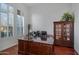 Home office with built-in bookcase and large windows at 2181 W Thompson Pl, Chandler, AZ 85286