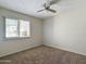 Bright bedroom with window and ceiling fan at 2228 E Campbell E Ave # 234, Phoenix, AZ 85016