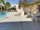 Relaxing poolside patio with tables and chairs at 2228 E Campbell E Ave # 234, Phoenix, AZ 85016