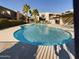 Community pool with surrounding lounge chairs at 2228 E Campbell E Ave # 234, Phoenix, AZ 85016