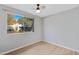 Bright bedroom with large window, hardwood floors, and neutral color palette at 225 N Standage -- # 77, Mesa, AZ 85201