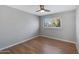 Bright bedroom featuring wood-look floors and ceiling fan at 225 N Standage -- # 77, Mesa, AZ 85201