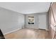 Bright living room with wood-look floors and white door at 225 N Standage -- # 77, Mesa, AZ 85201