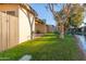 Landscaped backyard with pond view and grassy area at 2256 W Lindner Ave # 25, Mesa, AZ 85202