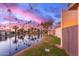 Scenic waterfront view with lush landscaping and palm trees at 2256 W Lindner Ave # 25, Mesa, AZ 85202