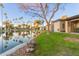 Community pond with palm trees and reflection of homes at 2256 W Lindner Ave # 25, Mesa, AZ 85202