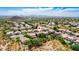 Aerial view showing home's location in a residential neighborhood with pools and desert landscape at 23046 N 21St St, Phoenix, AZ 85024