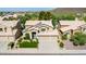 Aerial view of two-story house with solar panels, landscaped yard, and three-car garage at 23046 N 21St St, Phoenix, AZ 85024