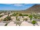 Aerial view of house and neighborhood with mountain views at 23046 N 21St St, Phoenix, AZ 85024