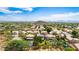 Aerial view of a residential neighborhood with desert landscape and mountain views at 23046 N 21St St, Phoenix, AZ 85024