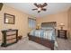 Cozy bedroom with a wooden bed frame, neutral walls, and soft natural light at 23046 N 21St St, Phoenix, AZ 85024