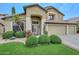 Charming two-story home featuring a well-manicured front yard and a spacious three-car garage at 23046 N 21St St, Phoenix, AZ 85024