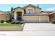 Two-story house with a three-car garage and well-manicured lawn at 23046 N 21St St, Phoenix, AZ 85024