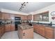 Charming kitchen featuring granite countertops, a kitchen island and plenty of cabinet space at 23046 N 21St St, Phoenix, AZ 85024