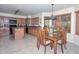 Well-lit kitchen adjacent to a dining area with wooden furniture and natural light at 23046 N 21St St, Phoenix, AZ 85024