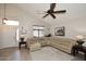 Spacious living room with vaulted ceilings, featuring a large sectional sofa and area rug at 23046 N 21St St, Phoenix, AZ 85024