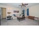 Comfortable living room with a neutral color scheme, ceiling fan, and classic decor at 23046 N 21St St, Phoenix, AZ 85024