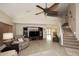 Bright living room with hardwood floors, staircase, and built-in entertainment center at 23046 N 21St St, Phoenix, AZ 85024