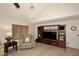 Relaxing living area featuring a comfortable recliner chair and a large entertainment center at 23046 N 21St St, Phoenix, AZ 85024