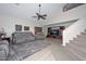 Open living room featuring vaulted ceilings, a ceiling fan, and a built-in media center at 23046 N 21St St, Phoenix, AZ 85024