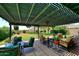 Relaxing patio with pergola, seating, and views of the backyard at 23046 N 21St St, Phoenix, AZ 85024