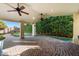 Covered patio with brick pavers, ceiling fans, and putting green view at 2336 Leisure World --, Mesa, AZ 85206