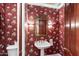 Charming powder room with floral wallpaper and pedestal sink at 2336 Leisure World --, Mesa, AZ 85206