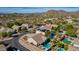 Aerial view showing neighborhood homes with pools and solar panels at 2355 N Cabot --, Mesa, AZ 85207