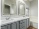 Elegant bathroom with double vanity, quartz countertop, and soaking tub at 2355 N Cabot --, Mesa, AZ 85207