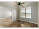 Well-lit bedroom featuring tile floors and a window with blinds at 2355 N Cabot --, Mesa, AZ 85207