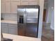 View of the stainless steel refrigerator with stainless steel appliances and grey cabinets at 2355 N Cabot --, Mesa, AZ 85207