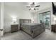 Spacious bedroom with ceiling fan and private balcony access at 2511 W Queen Creek Rd # 415, Chandler, AZ 85248