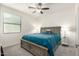 Comfortable bedroom with a king-size bed and plenty of natural light at 2511 W Queen Creek Rd # 415, Chandler, AZ 85248