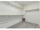 Spacious walk-in closet with ample shelving and hanging rods at 2511 W Queen Creek Rd # 415, Chandler, AZ 85248