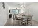 Bright dining room with a farmhouse table and seating for six at 2511 W Queen Creek Rd # 415, Chandler, AZ 85248