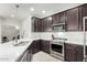 Modern kitchen with stainless steel appliances and white quartz countertops at 2511 W Queen Creek Rd # 415, Chandler, AZ 85248