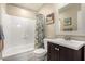 Bathroom with tub shower combo and updated vanity at 2526 N 22Nd Dr, Phoenix, AZ 85009