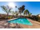 Community swimming pool with surrounding trees at 2526 N 22Nd Dr, Phoenix, AZ 85009