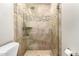 Updated shower with glass enclosure and tile surround at 2526 N 22Nd Dr, Phoenix, AZ 85009