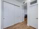 Home hallway with double sliding doors and built-in storage at 26646 N 46Th Pl, Cave Creek, AZ 85331