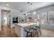 Modern kitchen with white cabinets, stainless steel appliances, and an island at 26646 N 46Th Pl, Cave Creek, AZ 85331